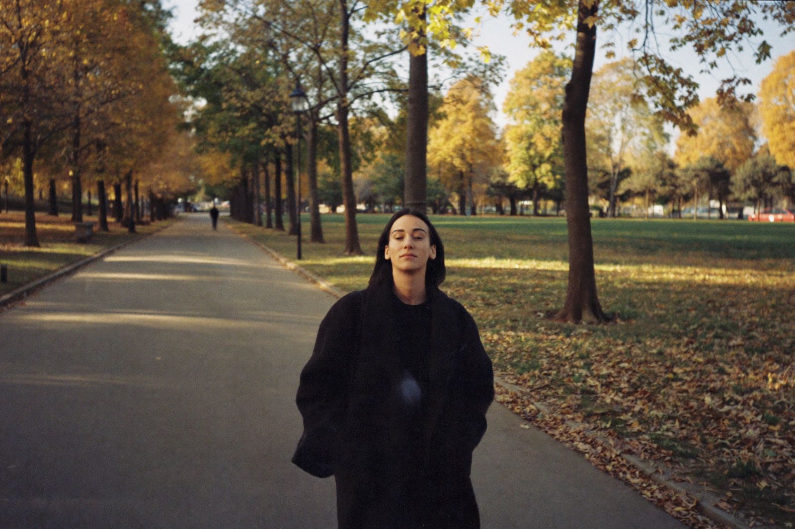 A woman on a quiet autumn walk in the park
